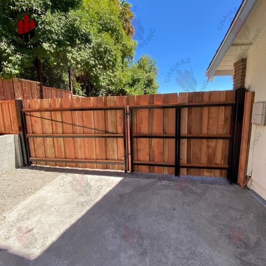 Wood driveway gate built by Chairez Fencing