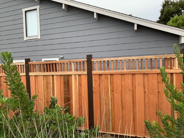 Custom wood fence design for backyard privacy